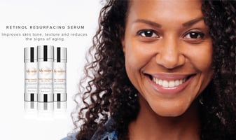 Beautiful woman with skincare products.